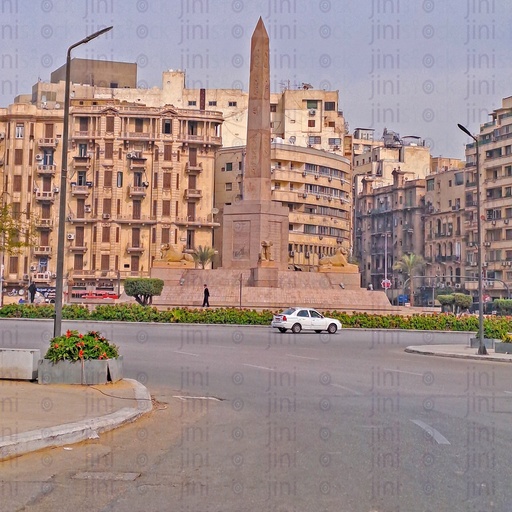 The obelisk,and Rams in Tahrir Square, Cairo, Egypt, and the Street was empty of cars, and is used as a background for designs on Cairo streets