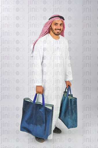 Saudi or Emirati or Khaliji man holding the shopping bags