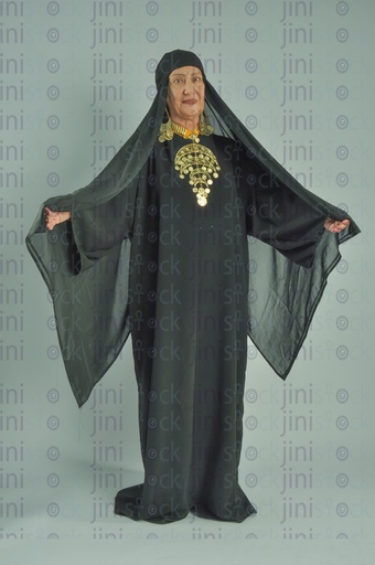 upper Egypt woman holding her hair's veil with her hand