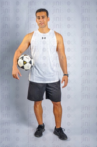 An Egyptian man holding a football