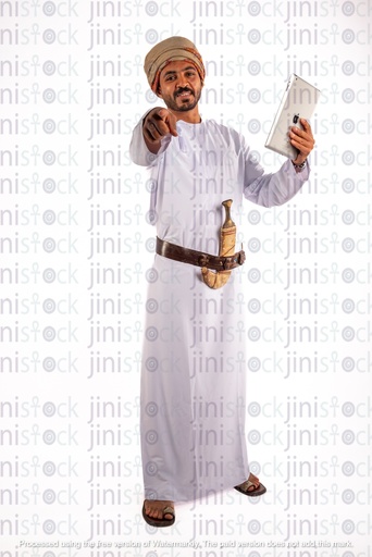 Omani arab khaliji from gulf holding iPAD happy and pointing at camera