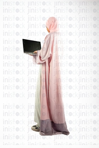 khaliji arab saudi woman working on a laptop obver the shoulder