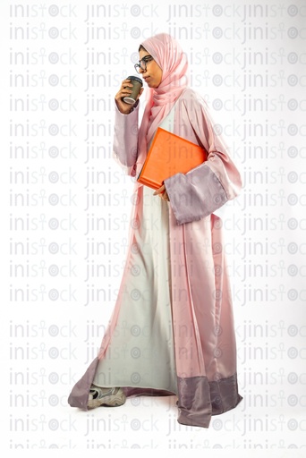 khaliji saudi arab woman from gulf carrying a file and drinking coffee in travel cup