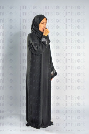 Saudi Arabian or Emirati woman or a woman from gulf coughing.