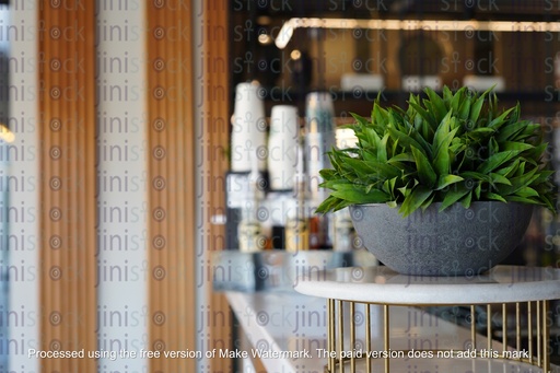 lantern in gold and coloured glasses on a wall