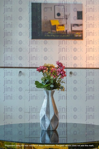 white flower vase on a table in a modern home