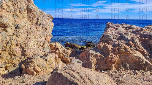 A Beach, rocks, and mountains in Dahab, south Sinai, Egypt