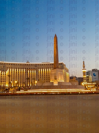 The obelisk, Rams, Mogamaa Al Tahrir and Omar Makram Mosque , in Tahrir Square, Cairo, Egypt at night, and the Street were empty of cars, use as a background for designs on Cairo streets.
