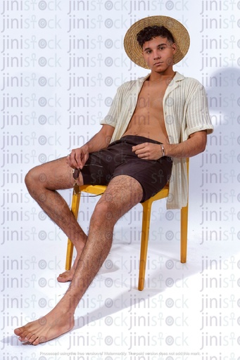 Egyptian man sitting wearing summer outfit