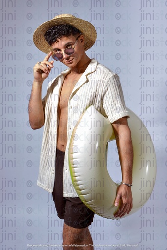 egyptian man wearing hat and sunglasses and carrying water floater