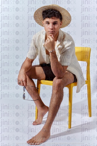 Egyptian man thinking about something in summer out fit