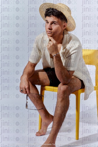 Egyptian man thinking about something in summer out fit