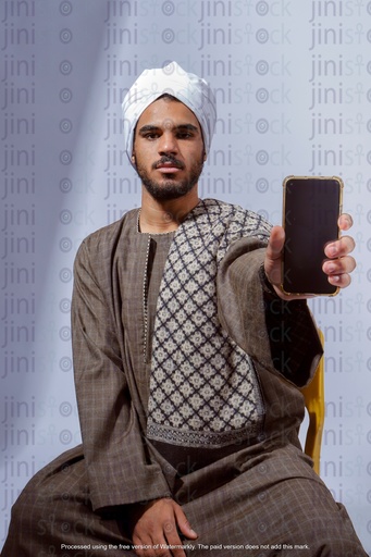 Egyptian man from upper Egypt holding mobile