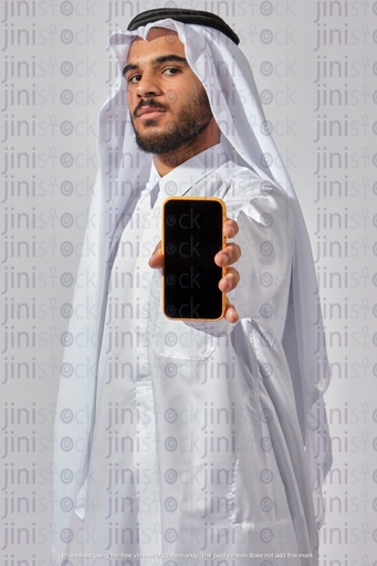 khaliji man from Qatar gulf Saudi holding a mobile phone