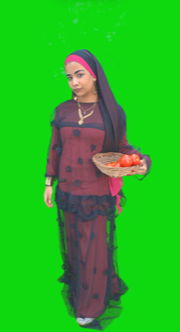 ِA Nubian woman wearing Nubian clothes or an Egyptian farmer girl holding a plate of tomatos
