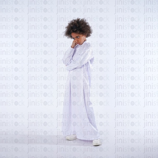 khaliji boy with curly hair from saudi gulf standing sad