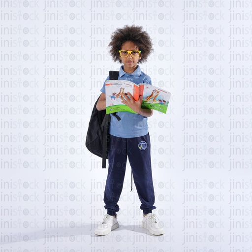 Egyptian boy wearing school uniform and carrying his bag and holding a book