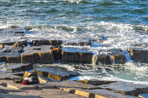 A beach and waves in Alexandria- Alexandria Corniche beach at sunset.