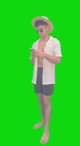 An Egyptian man wearing beach clothes and a cap is browsing or texting on his mobile phone and recommending the use of an app or something.