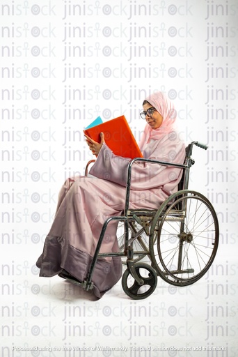 saudi khaliji woman on a wheelchair and working checking reports in a folder or file