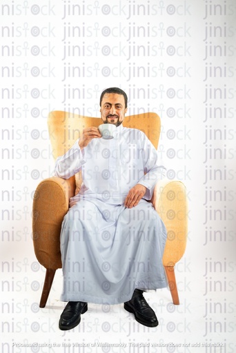 saudi khaliji man from gulf sitting on a chair drinking tea or coffee