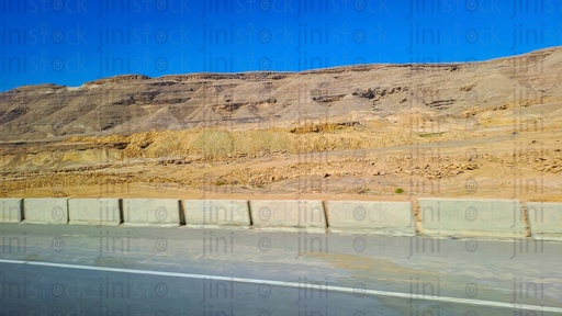 Mountains and an empty Road with no cars or buses on a traveling road in Egypt