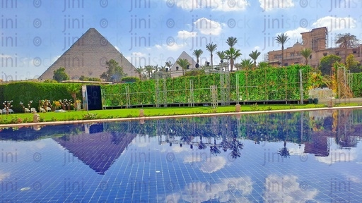 Pyramids and a garden and their reflections on the water.