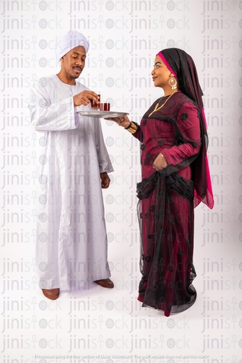 Nubian woman serving her husband a Nubian Egyptian man tea