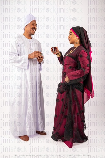 Egyptian man and woman drinking tea and talking