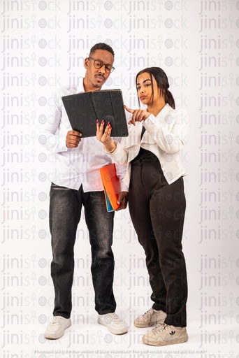 Egyptian man and woman looking at ipad and work