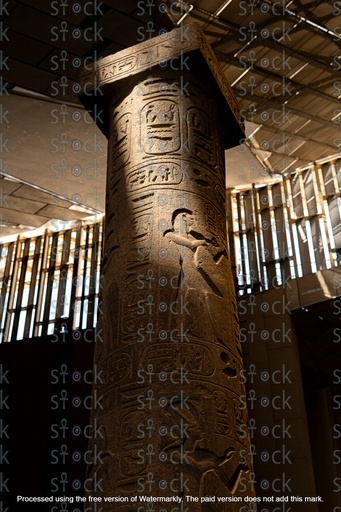 An ancient Egyptian statue wearing a crown.