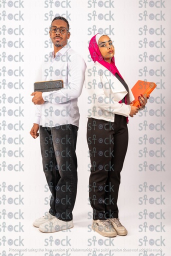 Veiled Nubian girl standing back to back with a Nubian young man