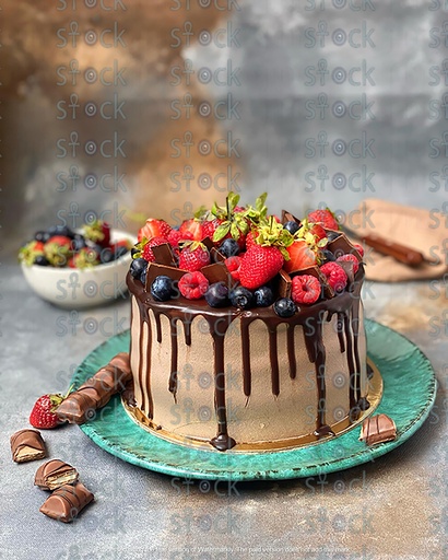 Chocolate cake decorated with strawberries and raspberries