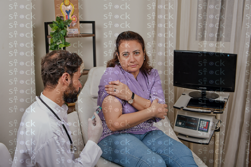 Patient receiving injection in arm 