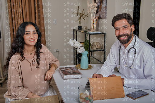 Smiling doctor with patient 