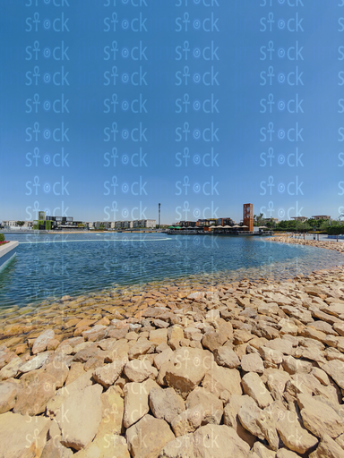Rocky shoreline by calm water