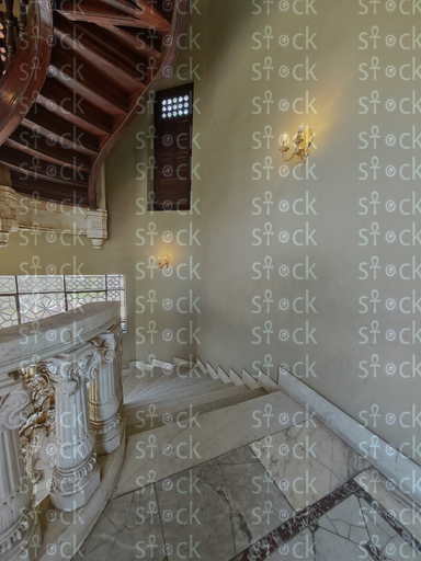 Sunlit marble stair landing