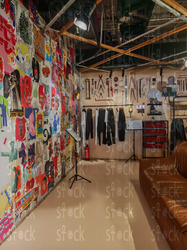 An art wall of tools and posters