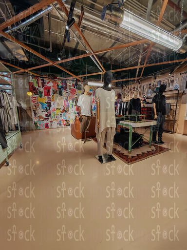 A group of mannequins in front of the posters wall