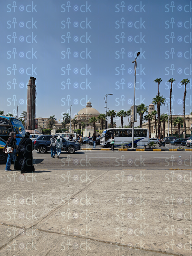 A serene campus view with the main building in the distance