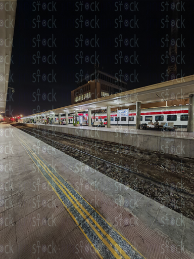 Train and passengers waiting inside the station 